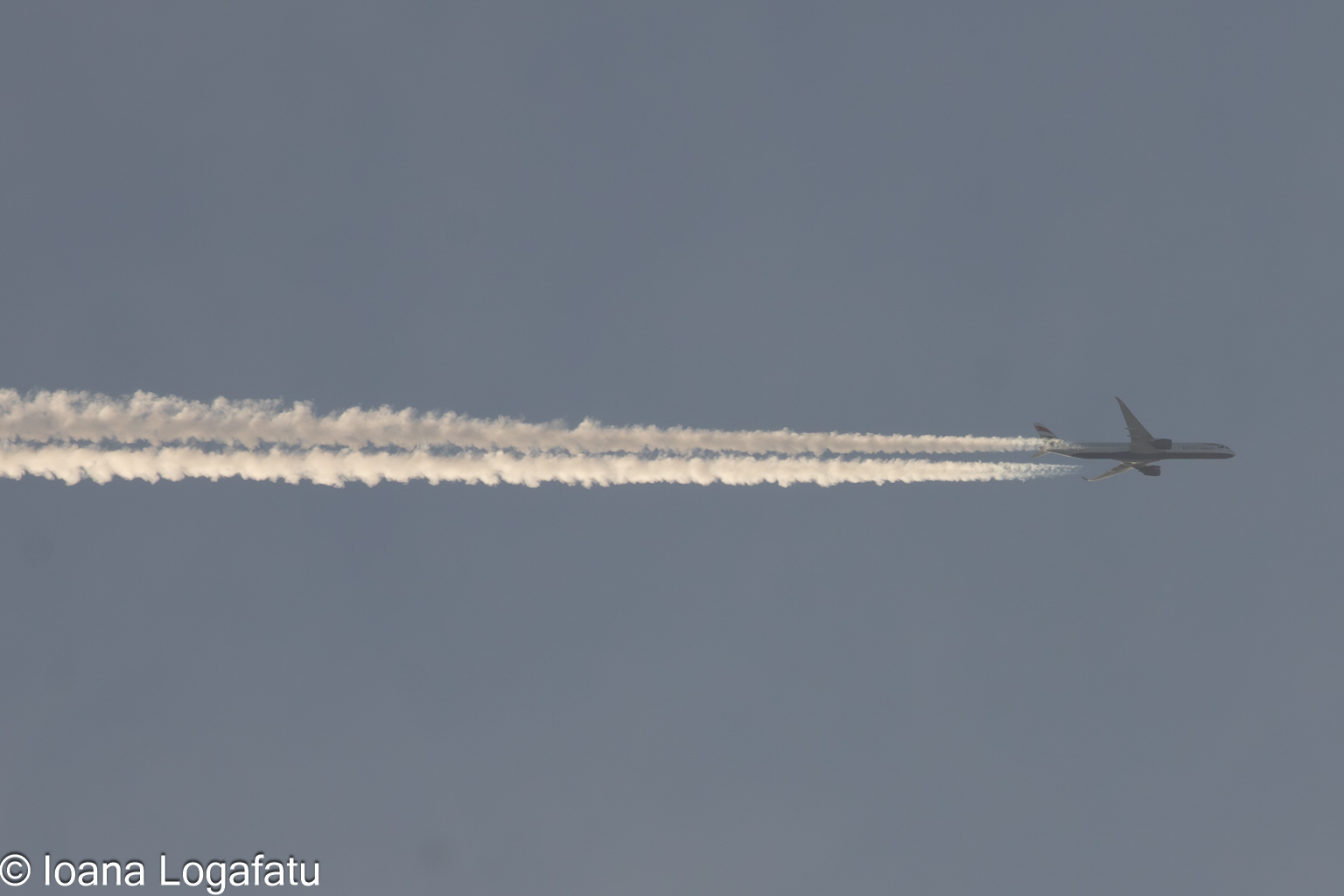 Plane gliding in a clear blue sky